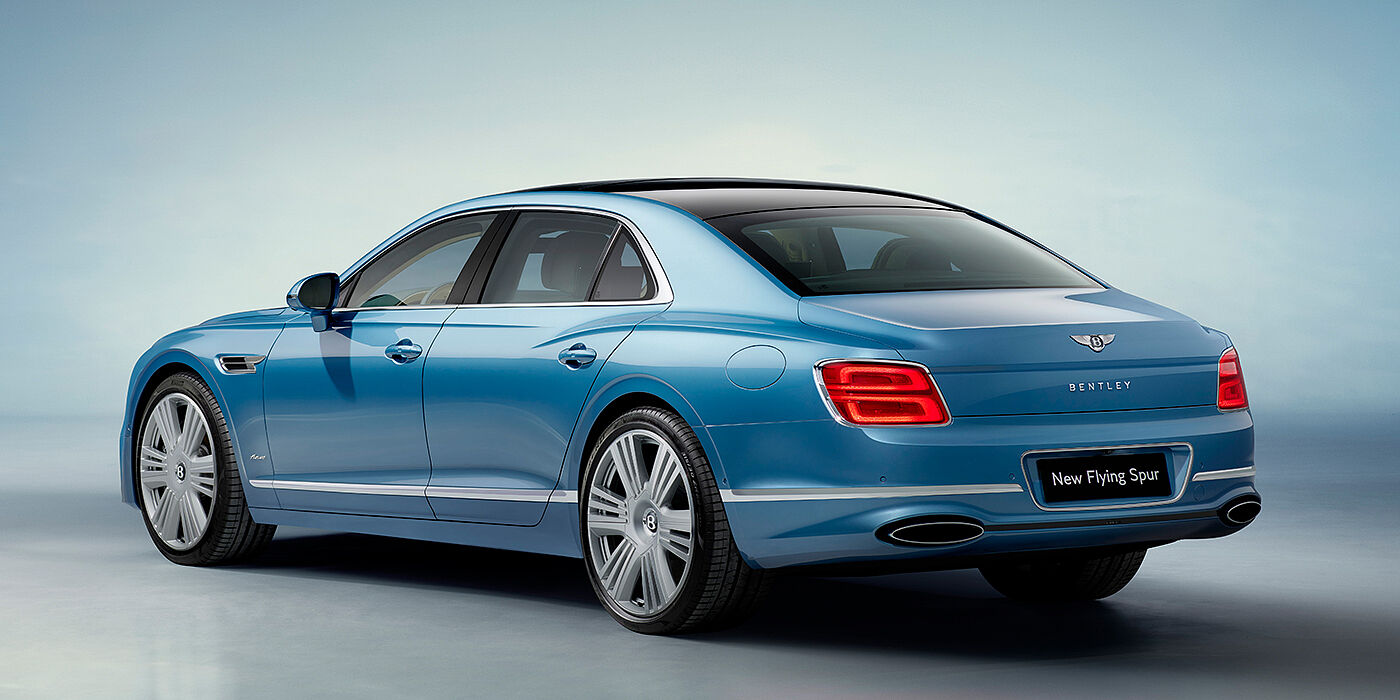Bentley Edinburgh New Bentley Flying Spur Azure sedan rear view in Light windsor blue by Mulliner paint with 22 inch Azure wheels and chrome exterior details