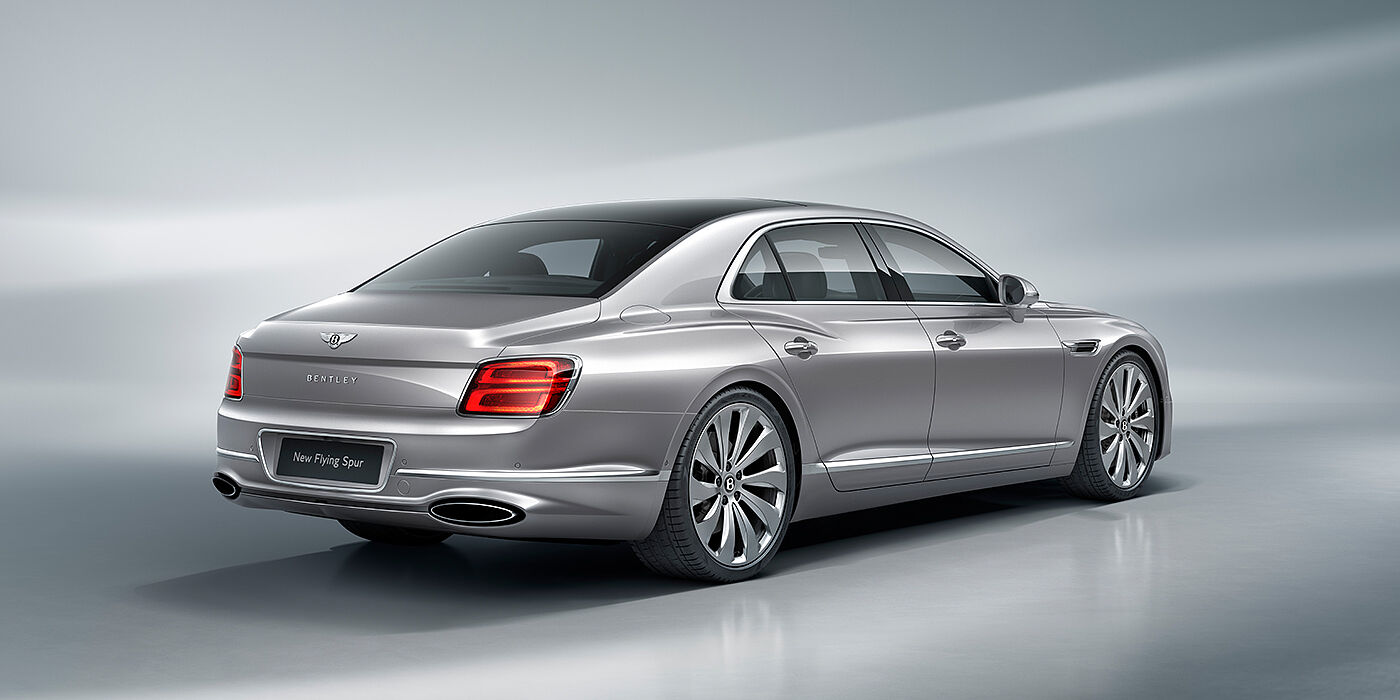 Bentley Edinburgh New Bentley Flying Spur sedan rear view in Silverlake paint with ten spoke wheels and chrome matrix grille