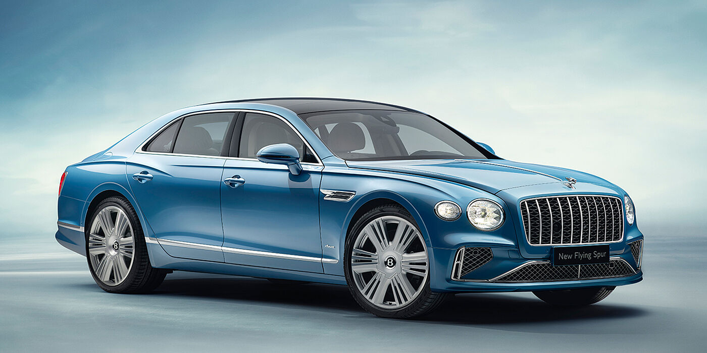 Bentley Edinburgh New Bentley Flying Spur Azure sedan front view in Light windsor blue by Mulliner paint with 22 inch Azure wheels and chrome exterior details