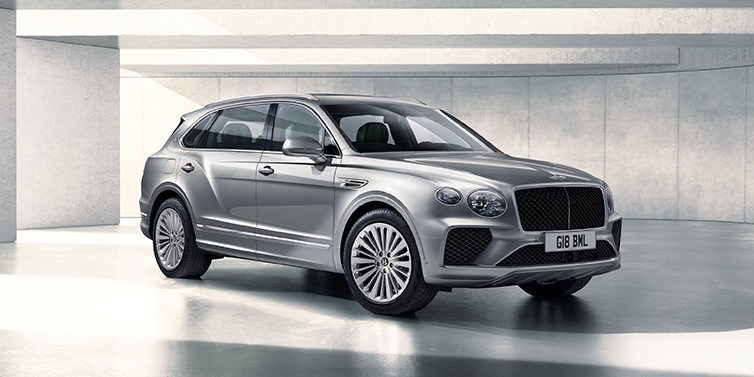 Bentley Edinburgh Bentley Bentayga Extended Wheelbase SUV front three quarter in Moonbeam paint with a grey background