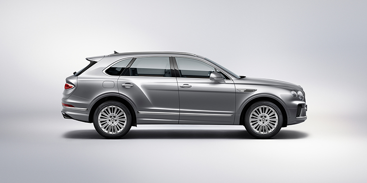 Bentley Edinburgh Bentley Bentayga SUV side profile in Moonbeam silver paint against white background featuring 21 inch 5 spoke wheels
