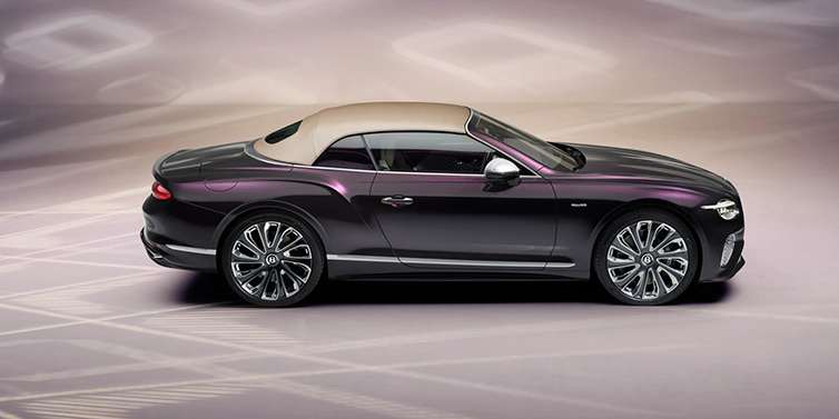 Bentley Edinburgh Bentley Continental GTC Mulliner convertible in profile with hood up, in Tanzanite Purple paint and 22 inch Mulliner painted and polished wheels