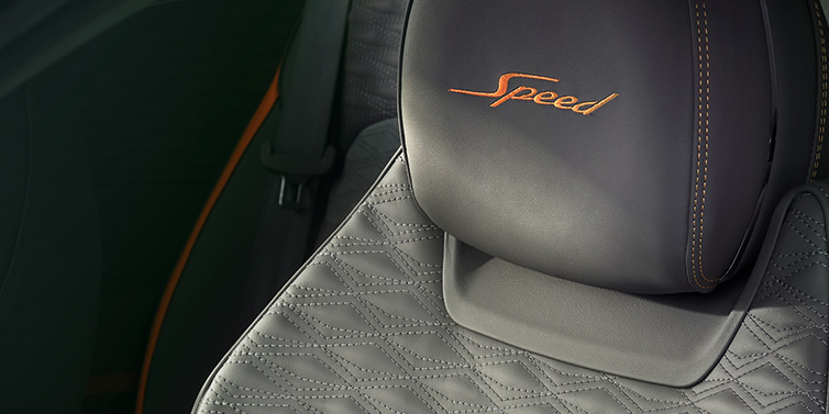 Bentley Edinburgh Bentley Continental GT Speed coupe seat detail in Gravity Grey hide and Speed emblem in Mandarin by Mulliner coloured embroidery