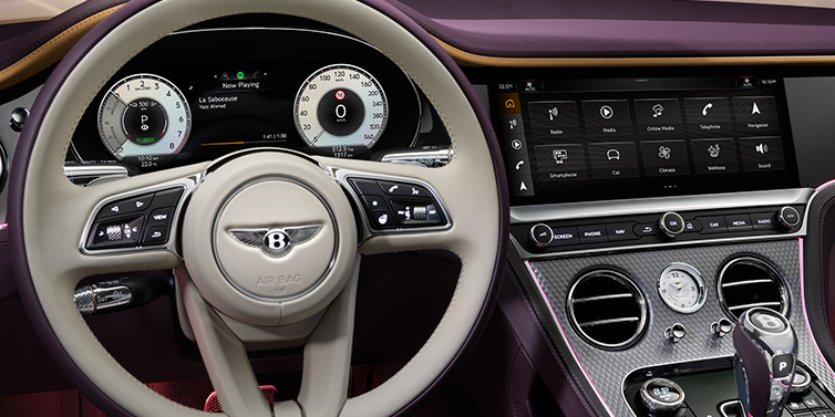 Bentley Edinburgh Bentley Continental GTC Mulliner convertible steering wheel and drivers screens surrounded by Damson purple and Linen hides